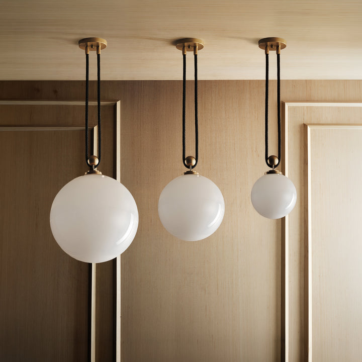 From left to right: Pulley 16, 12, and 8 (Natural Brass, Black Leather).