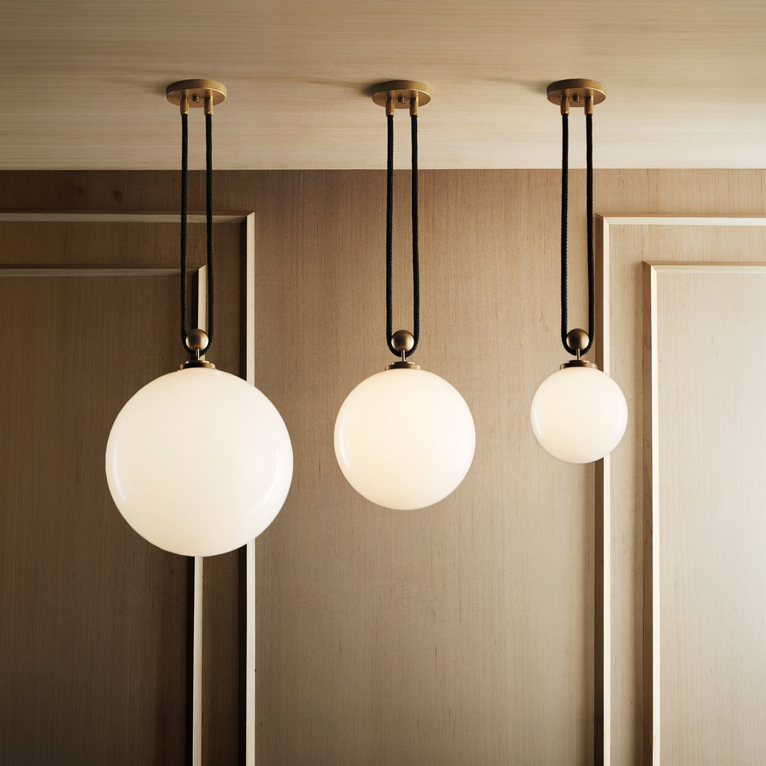 From left to right: Pulley 16, 12, and 8 (Natural Brass, Black Leather).